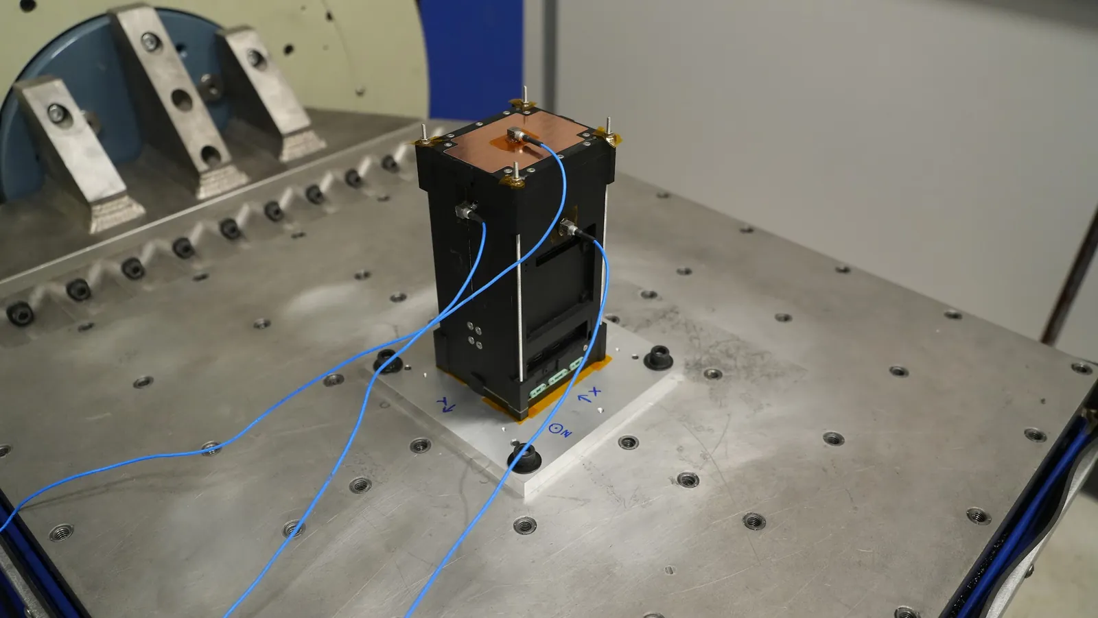 Aethero satellite mounted on a vibration table during qualification