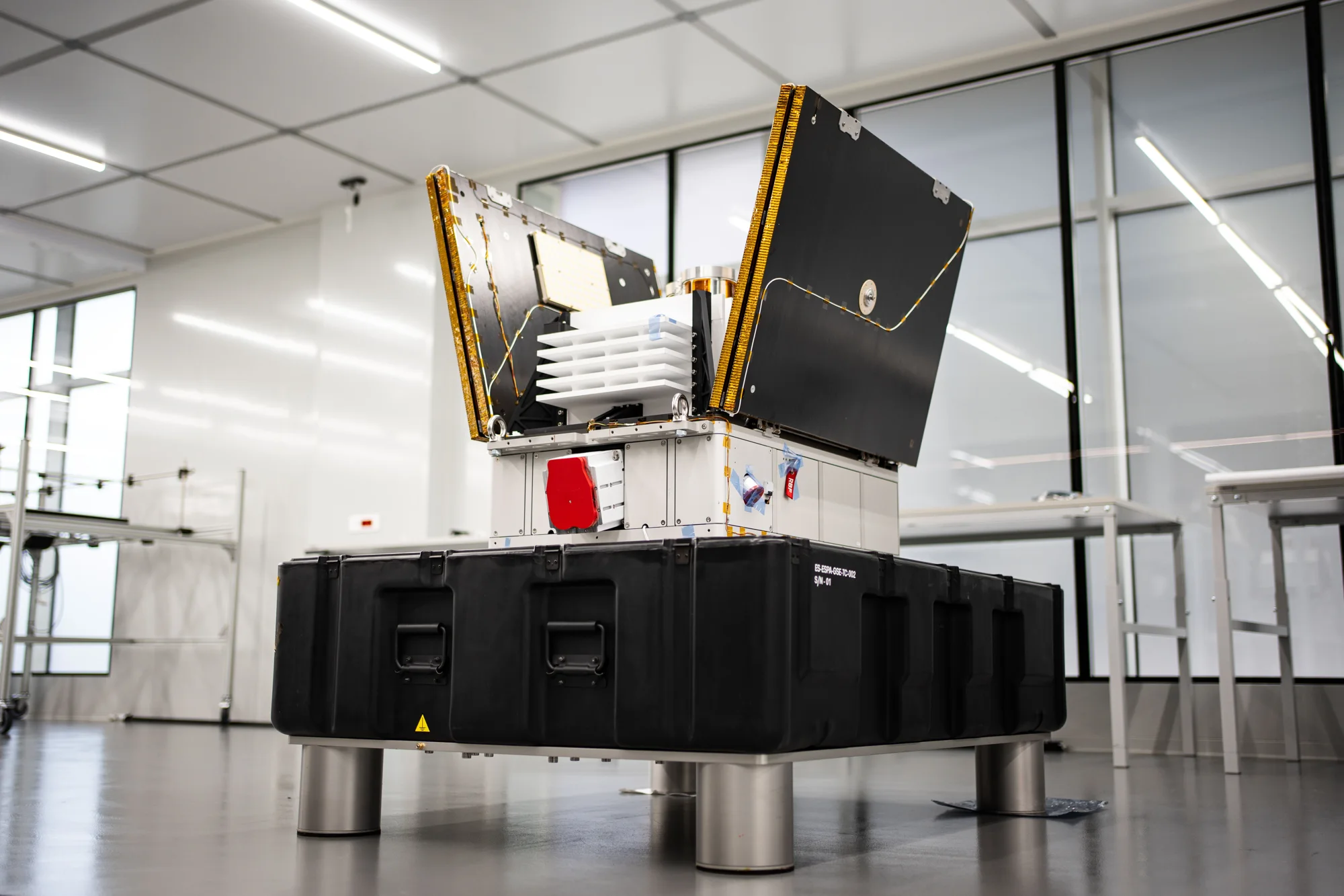 Titan flight unit on its ground-support stand with solar arrays deployed, three-quarter view